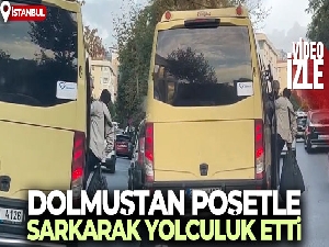 Dolmuştan poşetle sarkarak yolculuk etti
