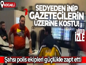 Sedyeden inip gazetecilerin üzerine koştu