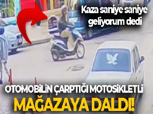 Otomobilin çarptığı motosikletli mağazaya daldı : O anlar kamerada