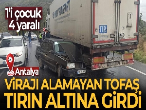 Virajı alamayan otomobil, tırın altına girdi: 1'i çocuk 4 yaralı