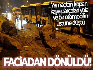 İzmir'de yamaçtan kopan kaya parçaları yola ve bir otomobilin üstüne düştü