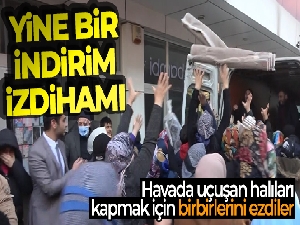 Havada uçuşan halıları kapmak için birbirlerini ezdiler