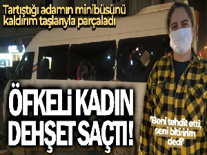 Öfkeli kadın telefonda tartıştığı adamın minibüsünü kaldırım taşlarıyla parçaladı