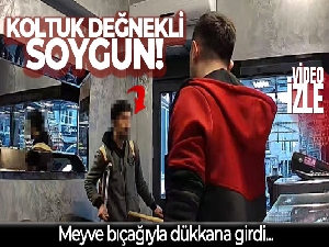 Fatih'te koltuk değnekli şüphelinin meyve bıçağıyla soygun girişimi kamerada