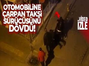Otomobiline çarpan taksi sürücüsünü dövdü