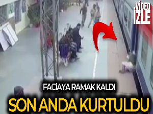 Hindistan'da trene binmeye çalışan yolcu ölümden döndü