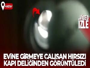 Evine girmeye çalışan hırsızı kapı deliğinden görüntüledi