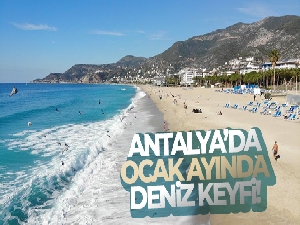Alanya'da Ocak ayının güneşli havasında deniz keyfi yaşadılar