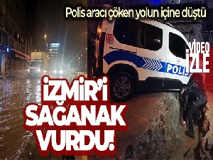 İzmir'i sağanak vurdu: Polis aracı çöken yolun içine düştü