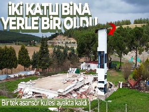 İki katlı bina yerle bir oldu, bir tek asansör kulesi ayakta kaldı