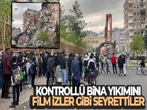 Kontrollü bina yıkımını film izler gibi seyrettiler