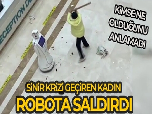 Sinir krizi geçiren kadın robota saldırdı