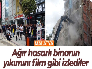 Ağır hasarlı binanın yıkımını film gibi izlediler