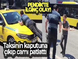 Pendik'te taksinin kaputuna çıkıp camı patlattı