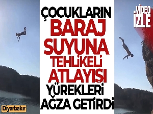 Çocukların baraj suyuna tehlikeli atlayışı yürekleri ağza getirdi