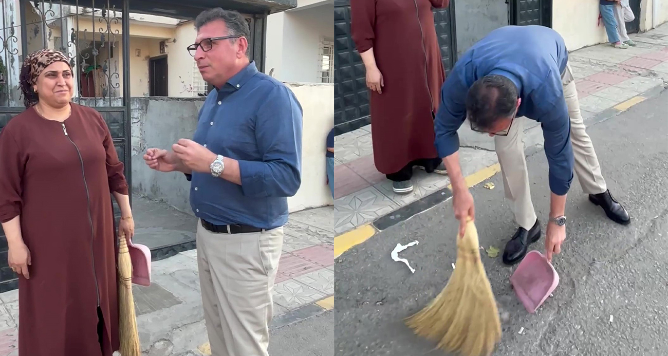 Belediye başkanı sokağı süpüren kadının elinden süpürgeyi alıp kendi süpürdü